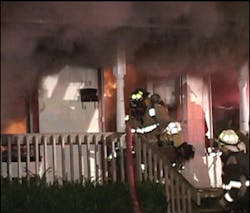To the right of the doorway is Firefighter M. Lukac, the original nozzleman who lost his helmet and dove over the hose crew to get out. He was not burned. To the right of the doorway is Firefighter M. Lukac, the original nozzleman who lost his helmet and dove over the hose crew to get out. He was not burned.