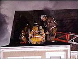 Firefighters work to put out Tuesday night's fire at the Sweet Retreat Cafe.