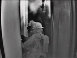 Photo 3. Firefighters enter a compartment on a ship. The push of heat into the hallway indicates they have fire inside the compartment. The wall in the hallway is hotter on the left than on the right, helping firefighters identify the fire room. Photo 3. Firefighters enter a compartment on a ship. The push of heat into the hallway indicates they have fire inside the compartment. The wall in the hallway is hotter on the left than on the right, helping firefighters identify the fire room.