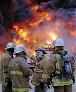 Oklahoma City fire commanders discuss strategies to control the B&M Oil Warehouse fire.