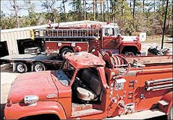 The fire engine in the background will replace the one in the foreground, which was smashed by a falling tree during Hurricane Rita.