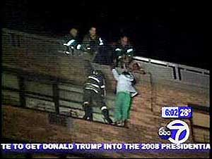 (Wingate-WABC, March 1, 2006) - Firefighters rescued a woman hanging out her window from a high-rise fire that ripped through the top floor of an apartment building in the Wingate section of Brooklyn.