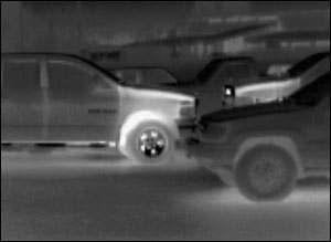Notice that certain parts of the vehicle retain heat longer, indicating that the vehicle has been driven recently. The wheels and engine compartment are normally the two most visible heat sources on a vehicle. Keep in mind that environmental conditions can impact how long these heat sources are visible to the TI and that solar heat can create misleading thermal images.
