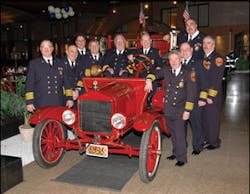 The Commack, NY, Fire Department is celebrating its 100th year of volunteer service. Pictured with the department&acirc;&euro;&trade;s first motorized apparatus, a 1921 Ford Model T Chemical Wagon, are, from left, Ex-Chiefs Angelo Sanzeri, 36 years of service (chief in 2003-2004); Joe Gurney, 32 years (1989-1990); John Bicocchi, 25 years (1997-1998); Bob Jinks, 36 years (1991-1992); Fred Meuser, 28 years (1981-1983); Frank Seeberger, 23 years (1979-1981); Joe Valvana, 34 years (1984-1987); Tony Napoli Sr., 31 years (1987-1989); Larry Schneckenburger, 29 years (1995-1996); and Frank Caputo, 25 years (1993-1994). Absent was Dan Brandenberger, 30 years (1999-2000).