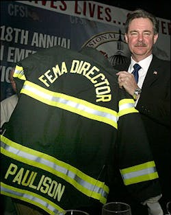 R. David Paulison with new turnout coat at the annual CFSI dinner. R. David Paulison with new turnout coat at the annual CFSI dinner.