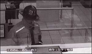This bank surveillance photo shows the robbery suspect disguised as a firefighter.