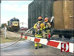 The boxcar was carrying 18 tightly-wound rolls of paper when it caught fire.