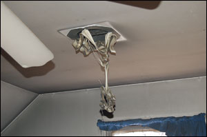 Extreme heat distorted a light fixture on the ceiling of a room on the second floor.