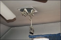Extreme heat distorted a light fixture on the ceiling of a room on the second floor. Extreme heat distorted a light fixture on the ceiling of a room on the second floor.