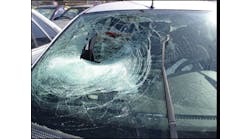 Be real careful here. It is not normal, although possible, that a deploying passenger frontal airbag will tear a hole in the laminated glass. Look at the glass for hair or flesh on the inside and the outside. This damage could be caused by a person or object into which this vehicle ran.