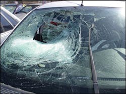 Be real careful here. It is not normal, although possible, that a deploying passenger frontal airbag will tear a hole in the laminated glass. Look at the glass for hair or flesh on the inside and the outside. This damage could be caused by a person or object into which this vehicle ran.
