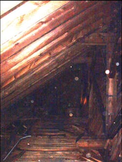 Photo 8. This photo shows how difficult it would be to not only find the fire, but a safe access route to the fire in the church without the use of the TIC. The camera enabled crews to “see†the walkway and operate a line onto the burning bays of the cockloft. Photo 8. This photo shows how difficult it would be to not only find the fire, but a safe access route to the fire in the church without the use of the TIC. The camera enabled crews to “see†the walkway and operate a line onto the burning bays of the cockloft.