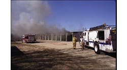 Smoke pushing out of numerous storage units indicates that the fire has extended beyond its point of origin.