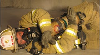 The firefighter lies on their left side tucking the S.C.B.A. into their body as much as possible and proceeds through the entanglement with their arms crossed over protecting the S.C.B.A. One arm can be used to &apos;swim&apos; hazards up and out of the way.