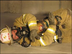 The firefighter lies on their left side tucking the S.C.B.A. into their body as much as possible and proceeds through the entanglement with their arms crossed over protecting the S.C.B.A. One arm can be used to 'swim' hazards up and out of the way. The firefighter lies on their left side tucking the S.C.B.A. into their body as much as possible and proceeds through the entanglement with their arms crossed over protecting the S.C.B.A. One arm can be used to 'swim' hazards up and out of the way.