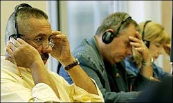Firefighter Al Fuentes, left, who was trapped in the World Trade Center rubble but escaped, and Al and Sally Regenhard, parents of firefighter Christian Regenhard, who was killed in theTrade attacks, join other family members of WTC victims as they listen to newly disclosed tapes Aug. 16. Firefighter Al Fuentes, left, who was trapped in the World Trade Center rubble but escaped, and Al and Sally Regenhard, parents of firefighter Christian Regenhard, who was killed in theTrade attacks, join other family members of WTC victims as they listen to newly disclosed tapes Aug. 16.