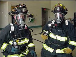 Two firefighters connected to an Emergency Breathing Support Systems (EBSS). Once connect, the mobility of both firefighters will be restricted. Two firefighters connected to an Emergency Breathing Support Systems (EBSS). Once connect, the mobility of both firefighters will be restricted.