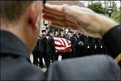 RAMSEY NJ USA -- Firefighters carry the flag draped casket of New York City firefighter Michael Reilly from St. Paul Roman Catholic Church in Ramsey, N.J., Friday, Sept. 1, 2006 after a funeral service. Reilly, 25, a probationary firefighter, perished Sunday while fighting a blaze in the Bronx, N.Y. Lt. Howard Carpluk also was killed.