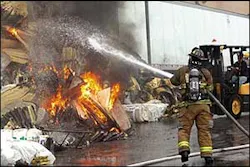More than 100 firefighters and 40 firetrucks from three counties converged to battle the blaze, but were hampered by water supply problems.