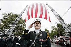 North Hudson Regional Fire and Rescue Battalion Chief Jack Farrington leads a salute for firefighter Vincent Neglia outside Our Lady of Fatima Church following Neglia's funeral Sept. 14. North Hudson Regional Fire and Rescue Battalion Chief Jack Farrington leads a salute for firefighter Vincent Neglia outside Our Lady of Fatima Church following Neglia's funeral Sept. 14.