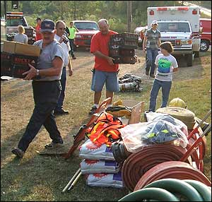 Members of the Hay Valley Volunteer Fire Department gather donations sent by the Washington Volunteer Fire Department in Connecticut.