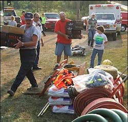 Members of the Hay Valley Volunteer Fire Department gather donations sent by the Washington Volunteer Fire Department in Connecticut. Members of the Hay Valley Volunteer Fire Department gather donations sent by the Washington Volunteer Fire Department in Connecticut.