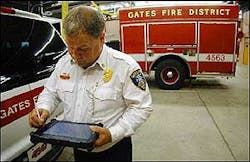 Gates Fire Chief Jim Harrington practices with a GPS device.