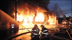 Cohoes Firefighters Joe Pailley and Jim Darwak operate a monitor at the front of the bakery. Cohoes companies were on the scene for 23 hours. Cohoes Firefighters Joe Pailley and Jim Darwak operate a monitor at the front of the bakery. Cohoes companies were on the scene for 23 hours.