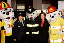 Upton, MA, Firefighter Bonnie Lopez and Marcia Gay Harden pose with fire prevention characters at the FDNY Fire Museum, where the celebration was held. Upton, MA, Firefighter Bonnie Lopez and Marcia Gay Harden pose with fire prevention characters at the FDNY Fire Museum, where the celebration was held.