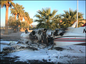 The cabin area of the twin engine plane burst into flames upon impact with the ground.