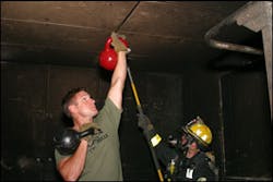 The author uses a set of kettlebells in a similar fashion to a firefighter performing overhaul. The author uses a set of kettlebells in a similar fashion to a firefighter performing overhaul.