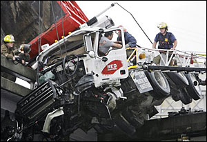 An accident left this truck hanging off a New Orleans overpass.