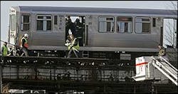 Chicago firefighters and Chicago Transit Authority workers inspect the last car of an elevated commuter train that derailed Dec. 19 in Chicago. Chicago firefighters and Chicago Transit Authority workers inspect the last car of an elevated commuter train that derailed Dec. 19 in Chicago.