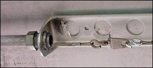 A close-up view of the fusible link that is found in the stove hood, which can activate the system if melted by fire.