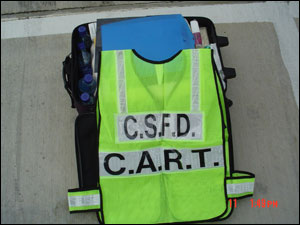 Members of the College Station C.A.R.T. are easily identified on the firegound with their vest and 'tool kit.'