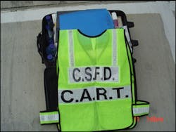 Members of the College Station C.A.R.T. are easily identified on the firegound with their vest and &apos;tool kit.&apos;