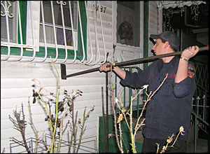 firefighter uses the homemade window bar forcible entry tool designed by FDNY Ladder 126.