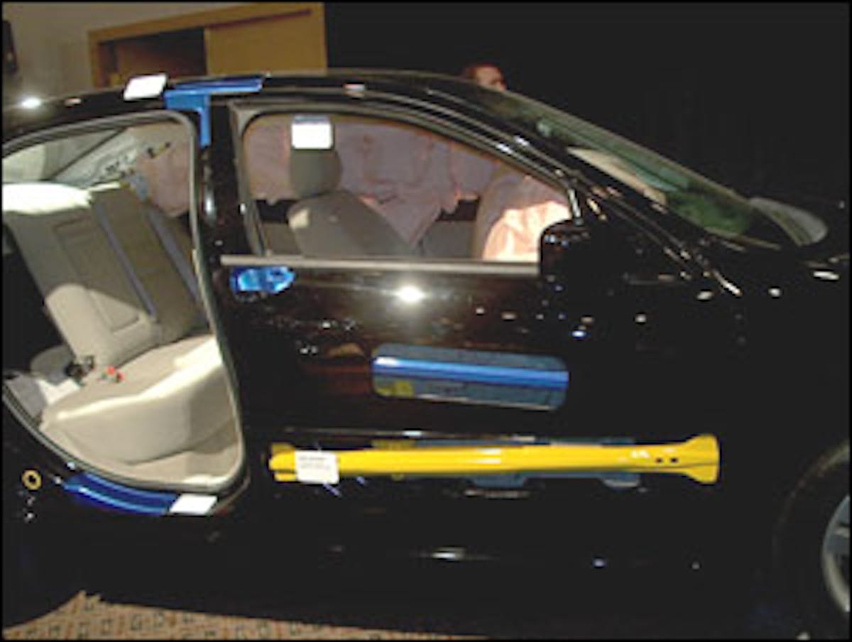 With the outer door panel cut away, it is possible to see the location of the two door collision beams on the Fusion. Note that all the exposed blue metal in this auto show display represents where ford has placed multiple layers of high-strength steel so their vehicle can meet the 2007 Federal crash standards.