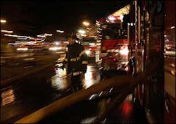 A firefighter walks past several fire engines, Feb. 25. A firefighter walks past several fire engines, Feb. 25.
