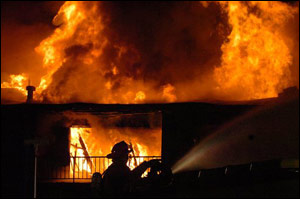 Firefighters battle a three-alarm apartment fire in York, Pa., on Saturday, March 10, 2007. Andrew Stern, chief of the Springettsbury Township Fire Department, said the building with about 20 apartments was fully engulfed in flames by the time firefighters arrived.