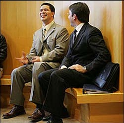 Isaac Feliciano (left) shares a laugh with one of his lawyers, William Maniatis.