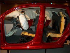 This view of the Caliber display shows the inflated driver's frontal airbag and the driver's knee bag. Note the low positioning of the knee bag system. It will be difficult to see the knee bag blowout panel at a crash scene if the knee bag has not deployed.