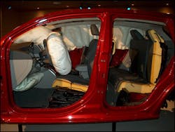This view of the Caliber display shows the inflated driver&apos;s frontal airbag and the driver&apos;s knee bag. Note the low positioning of the knee bag system. It will be difficult to see the knee bag blowout panel at a crash scene if the knee bag has not deployed.