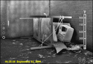 Photo 4 - A collapse has completely obstructed all heat from the victim. As such, firefighters must consider the nature of the incident and whether potential victims are in the debris.