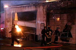 Kokomo firefighters battle a blaze as it engulfs the city's Emergency Management Agency's building.
