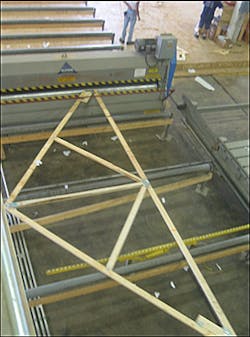 The truss pass through a second press and is then ready to be shipped for assembly at the construction site.