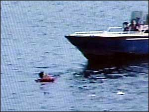 Video captured by a security camera shows Schaffer scaling a fence and running up to where the woman jumped in.