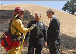 Tim Walsh from the Marin County Fire Department (left to right) Marin County Chief Ken Massucco and Bob Courtemanche from Fireman&apos;s Fund Insurance Company talk discuss the program after the demonstration.