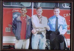 Michael French, far right, is congratulated by his uncle, Marvin Campbell, center, and Michael Campbell, his cousin. Michael French, far right, is congratulated by his uncle, Marvin Campbell, center, and Michael Campbell, his cousin.