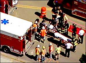 Several injured construction workers could be seen being loaded into ambulances next to the building.